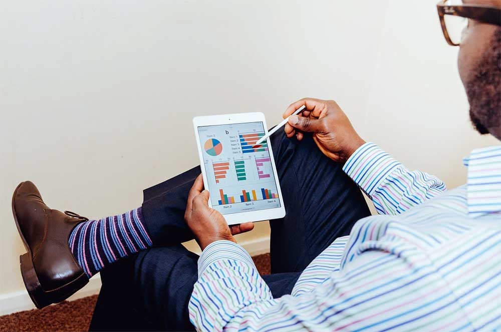 man looking at business results